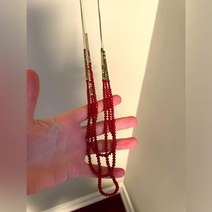Red and gold long necklace